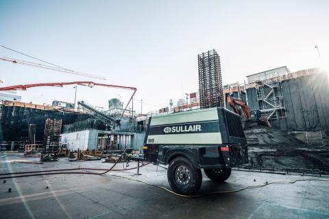 Sullair 185 cfm portable diesel air compressor on construction site